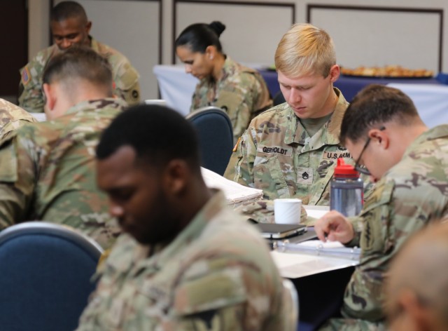 Unit ministry team members pray during a three-day summit at Camp Zama, Japan, Aug. 15, 2023. The summit, which was the first-ever conducted by U.S. Army Japan, included sessions on leadership development, lessons learned and fiscal year planning, as well as team-building activities.