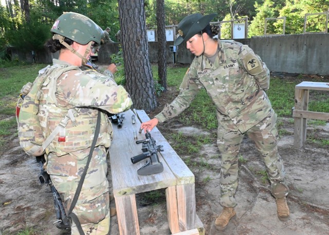 Staff Sgt. Wendy Kelley, a drill sergeant with Company D, 31st Engineer Battalion, tests trainees on their ability to load and unload a M26 Modular Accessory Shotgun System Wednesday on Range 33. 