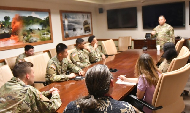 U.S. Army Yuma Proving Ground Command Sgt. Maj. Mark Millare (top right) speaks with several single Soldiers during a recently held Better Opportunity for Single Soldiers (BOSS) meeting. The BOSS program is an Army-wide program and serves as a...