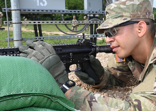 Pvt. Walter Sollet, a trainee with Company B, 1st Battalion, 48th Infantry Regiment, prepares to confirm the aim on his M4 rifle Aug. 2 on Range 11. 