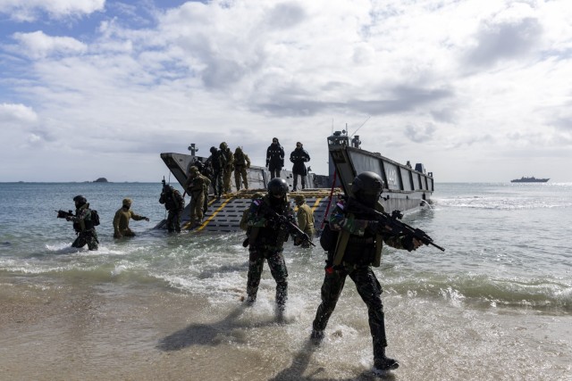 Indonesian National Armed Forces and Australian Amphibious Force Ground Combat Element soldiers from 1st Battalion, the Royal Australian Regiment, disembark an LHD Landing Craft to secure a beach during a Wet and Dry Environmental Rehearsal serial, during Exercise Talisman Sabre 23. 
