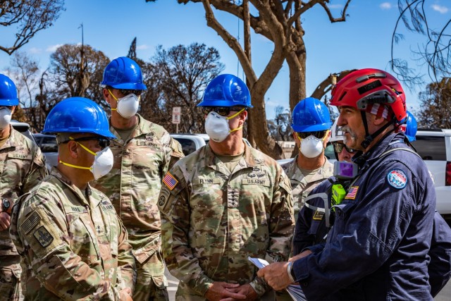 Army Gen. Charles A. Fynn, commanding general of the U.S. Army Pacific, alongside the command element of the Combined Joint Task Force 50 meets with search, rescue and recovery personnel in Lahaina, Maui, Hawaii, Aug. 15, 2023.