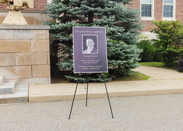 A plaque was unveiled to commemorate the dedication of the Fred Coppola Conference Room at Picatinny Arsenal.