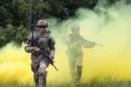 Army Sgt. 1st Class Cody Beadle, left, and Spc. Dustin Feldner compete in the U.S. Army Forces Command Best Squad Competition at Fort Campbell, Ky., Aug. 17, 2023.
