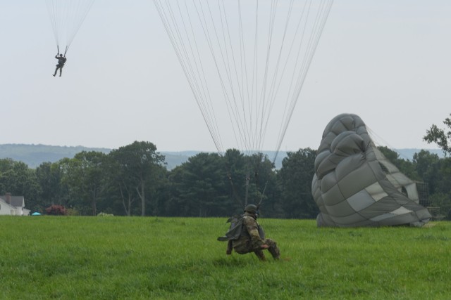 A paratrooper lands in the drop zone after jumping during the annual Leapfest International Parachute Competition and training event hosted by the Rhode Island National Guard on August 5, 2023.