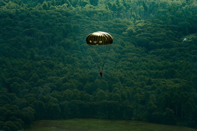 A paratrooper steers towards the drop zone while jumping during the annual Leapfest International Parachute Competition and training event hosted by the Rhode Island National Guard on August 5, 2023.
