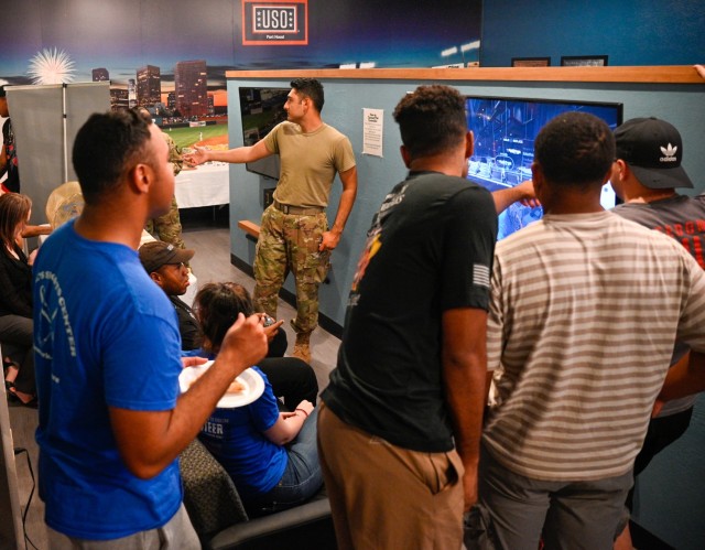 As the Apex showdown against JBSA looms, a group of Soldiers gather in the game room of the Fort Cavazos USO. Engrossed in discussion, they strategize and share insights in anticipation of the upcoming match. (U.S. Army photo by Eric Franklin, Fort Cavazos Public Affairs)