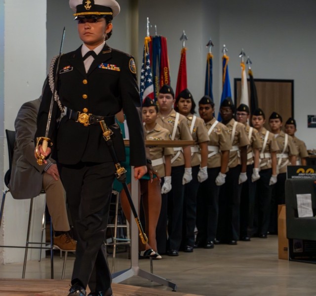 Female members of the Stony Point High School JROTC of Round Rock, Texas, participate in a flag ceremony during Army Futures Command’s Women’s Equality Day educational observance in Austin, Texas, Aug