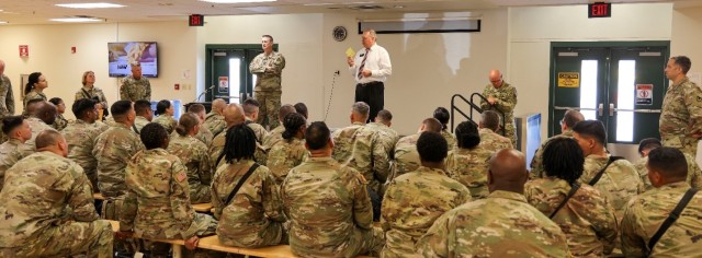 Elder Michael Bosley, a volunteer with the Fort Cavazos Garrison Chaplain’s Office, explains the prayer card to Soldiers from the 373rd Combat Sustainment Support Battalion before they depart Fort Cavazos. (U.S. Army photo by Sgt. 1st Class Justin Hardin, Mobilization Support Brigade)
