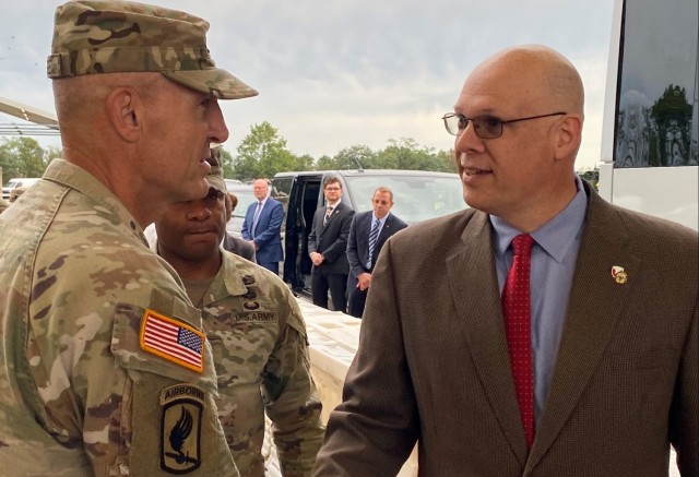 Joseph Scheff, the 405th Army Field Support Brigade deputy to the commander, greets Vice Chief of Staff of the Army Gen. Randy George upon his arrival to the Coleman Army Prepositioned Stocks-2 worksite in Mannheim, Germany, Aug. 25.
