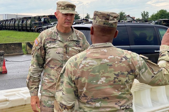 The 21st Theater Sustainment Command’s commanding general, Brig. Gen. Ronald Ragin, greets Vice Chief of Staff of the Army Gen. Randy George upon his arrival to the Coleman Army Prepositioned Stocks-2 worksite in Mannheim, Germany, Aug. 25.