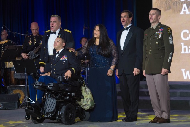 Chief of Staff of the U.S. Army Gen. Mark A. Milley, U.S. Army Capt. Luis Avila and wife Claudia,  Secretary of the Army Dr. Mark T. Esper, and Sgt. Maj. of the U.S. Army Daniel A. Dailey sing the Army song during the 243rd Army Birthday Ball at the Washington Hilton Hotel in Washington, D.C., June 16, 2018. (U.S. Army photo by Zane Ecklund)