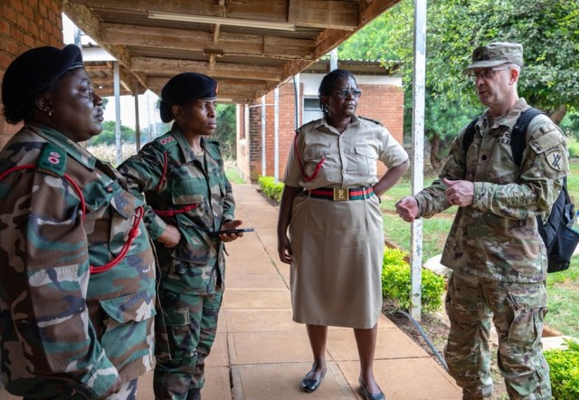 (U.S. Army Lt. Col. Brian Howell from the U.S. Army Southern European Task Force, Africa (SETAF-AF) CA BN, engages with Lt. Col. Takondwa Itaye, left, Capt. Regina Chigona and Lt. Col. Nukwase Ngwata, Malawi Defence Force (MDF), to assess their capability to conduct Civil Military Coordination (CIMIC) training for potential future partnerships at the MDF Barracks, Malawi, Africa, April 18, 2023.)