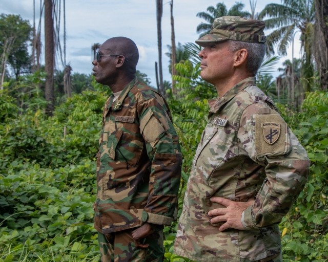 (U.S. Army Maj. Victor Argilagos, medical logistics officer,  U.S. Army Southern European Task Force, Africa (SETAF-AF) CA BN, stands with Armed Forces of Liberia (AFL) Maj. Othello Nmah, acting training commander, during a civil military coordination (CIMIC) and medical capabilities assessment with the AFL Apr. 26, 2023 in Monrovia, Liberia. Bilateral civil affairs exchanges build military and civilian readiness for future joint humanitarian assistance and crisis response operations. (U.S. Army photo by Maj. Joe Legros)