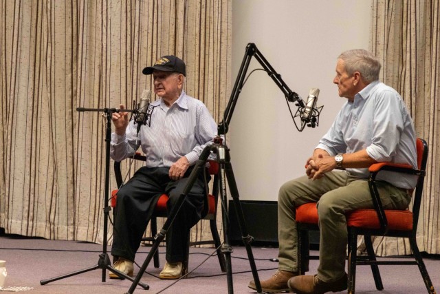 Holocaust survivor, propulsion expert and Army veteran Bob Sawada returns to DEVCOM AvMC to address the next generation of Army scientists. Seated with Sawada is moderator for the event, Richard Hatcher.