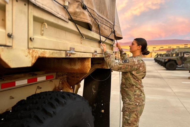 Army Sgt. Haley Riley, an avenger crewmember with 1-265th Air Defense Artillery Battalion, secures a light medium tactical vehicle in preparation for Hurricane Idalia, in Florida, Aug. 29, 2023.