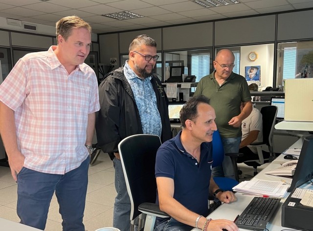 From left, USAG Italy Operations staff Walter Joslin, Manuel Becker Chief of USAG Italy Operations,  Questura staff pictured at computer Giovanni Colacicco of the Vicenza Questura, Orazio Pozzolo 
