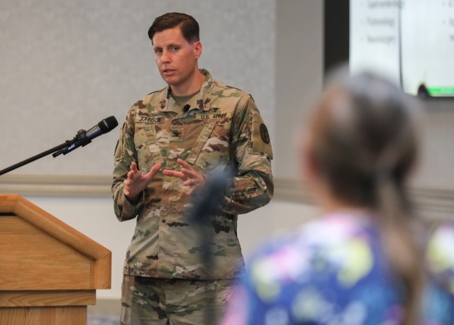 Col. Jeremy Johnson, commander of U.S. Army Medical Department Activity–Japan, answers a question during a medical town hall at the Camp Zama Community Club, Japan, Aug. 29, 2023. The meeting announced a new health care option for civilians and...