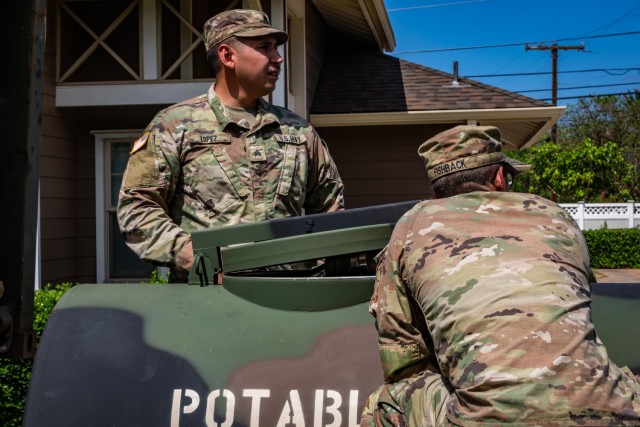 Soldiers assigned to the Army’s 225th Brigade Support Battalion, 2nd Infantry Brigade Combat Team, 25th Infantry Division and members of Joint Task Force 5-0 distribute water to the residents of Lahaina, Hawaii, Aug. 30, 2023.