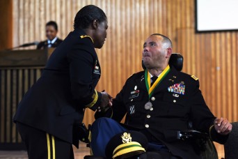 Wounded warrior receives one of the highest military police honors 