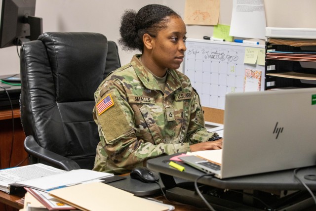 Pfc O&#39;Taysia Smalls, a paralegal assigned to the 3rd Battalion, 27th Field Artillery Regiment, 18th Field Artillery Brigade works at her desk March 30, 2023, on Fort Bragg. Smalls plans on staying in the military as long as possible as a paralegal.