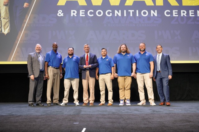 Keith Pugh, past president for APWA, and Scott Grayson, chief executive officer for APWA, presented the Directorate of Public Works Operations and Maintenance Division with the Exceptional Performance in Safety Award. Mark Branch, Nick Campagna, Brian Dosa, Mike Cruz-Miyasaki, Josh Musselman and Alvis Perry accepted the award during the APWA awards ceremony Aug. 28 in San Diego. (Courtesy photo)