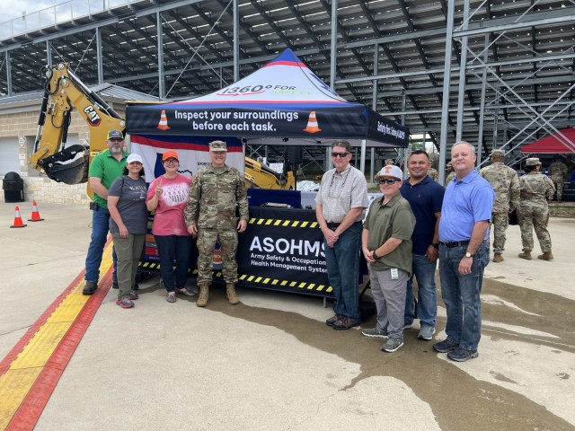 The Directorate of Public Works Safety Program showcases their tent at the Fort Cavazos Safety Day May 19 to promote the directorate’s safety culture and the ASOHMS. DPW and Garrison team members pose with Col. Chad R. Foster, former U.S. Army Garrison Fort Cavazos commander, during the event kickoff at Phantom Warrior Stadium. (Courtesy photo)