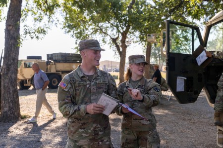 PFC Talon Denman, left, and his younger sister, 18-year-old PFC Lillian Denman, a rare brother-sister duo currently undergoing training together for the 13M Rocket System (MLRS/HIMARS) Crewmember role at Fort Sill, prepare to inspect a piece of equipment they&#39;re learning to operate in training.