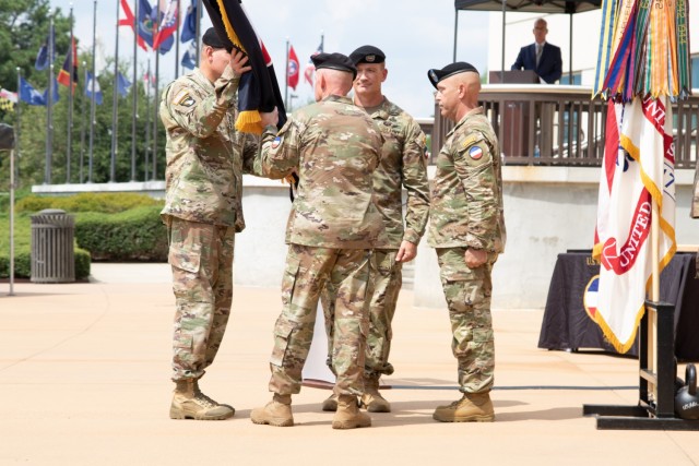 Command Sgt. Maj. Todd W. Sims, the outgoing command sergeant major for the U.S. Army Forces Command, passes the command colors to Gen. Andrew P. Poppas, the commanding general of FORSCOM, during a change of responsibility ceremony at the FORSCOM headquarters on Fort Liberty, N.C., September 8, 2023. The ceremony underscores the Army’s dedication to maintaining a seamless transition of leadership.