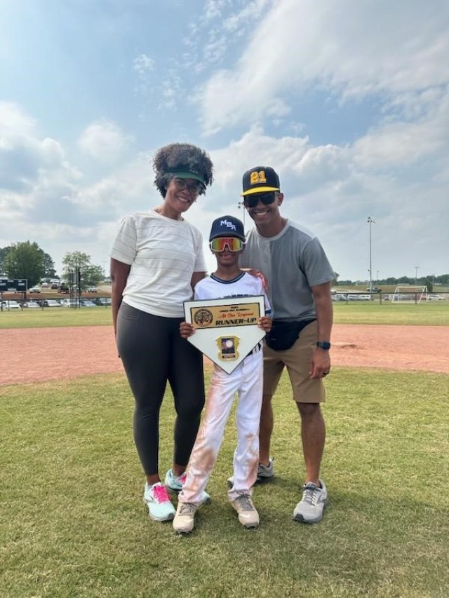 Waldemar Ramírez III  and his wife with their son, Ethan after an 8u baseball tournament in North Alabama.