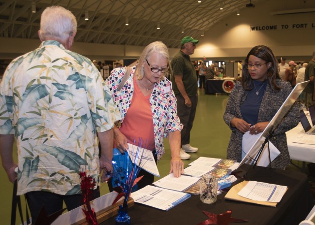 Africa Nichols, a TRICARE beneficiary counseling and assistance coordinator with General Leonard Wood Army Community Hospital, provides information to retired service members and their families Saturday in Nutter Field House during the Retiree Appreciations Days events. 