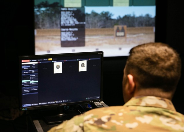 Soldier views targets at the Engagement Skills Trainer facility