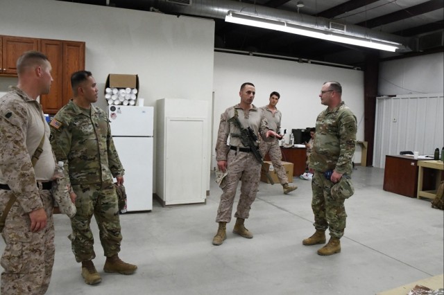 U.S. Army Yuma Proving Ground Commander Col. John Nelson (right) and Command Sgt. Maj. Mark Millare (left) recently spoke with Lt. Col Nick Freeman of the 15th Marine Expeditionary Unit (MEU), which was at U.S. Army Yuma Proving Ground from August...