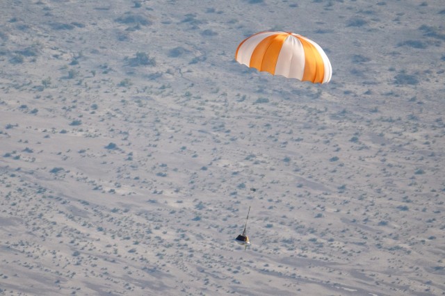 A training model of the sample return capsule is seen is seen during a drop test in preparation for the retrieval of the sample return capsule from NASA's OSIRIS-REx mission, Wednesday, Aug. 30, 2023, at the Department of Defense's Utah Test and Training Range. The sample was collected from asteroid Bennu in October 2020 by NASA’s OSIRIS-REx spacecraft and will return to Earth on September 24th, landing under parachute at the Utah Test and Training Range. Photo Credit: (NASA/Keegan Barber)