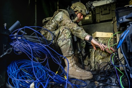 U.S. Army Spc. Dylan Horak, a network communication systems specialist with the 44th Expeditionary Signal Battalion – Enhanced, reconnects cables to a communication system after a drone attack during Saber Junction 23 at the Joint Multinational Readiness Center near Hohenfels, Germany, Sept. 11, 2023. U.S. Army Soldiers and NATO troops train with drones to simulate modern weapon systems which help their militaries update doctrine and training to combat against developing and future threats. 

Saber Junction 23 is an annual U.S. Army exercise with NATO allies and partners including 4,000 participants from 16 different countries training together from Aug. 28 to Sept. 23, 2023. The primary training audience for the exercise is the 2nd Cavalry Regiment, a U.S. Army Stryker Brigade Combat Team based in Germany. While U.S.-led, this exercise will develop and enhance NATO allies and partners’ interoperability and readiness.