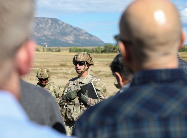 FORT CARSON, Colo. — Col. Brian Gilbert, commander, 3rd Armored Brigade Combat Team, 4th Inf. Div., briefs senior executive staff members with the Advanced Professional Executive, Senior Executive Program (APEX) during their visit to Fort...