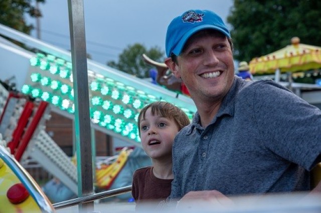 Chad Durance and his son, Joshua, enjoy a carnival ride on Friday at Oktoberfest. 