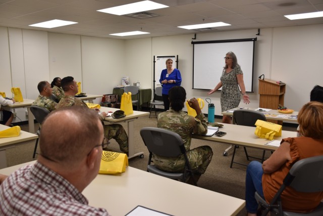 Angie Donovan, Human Resources coordinator for Killeen Independent School District, and Ashley York, coordinator for Auxiliary Human Resources at KISD, give an orientation to service members and spouses about the Service to Schools program Sept....