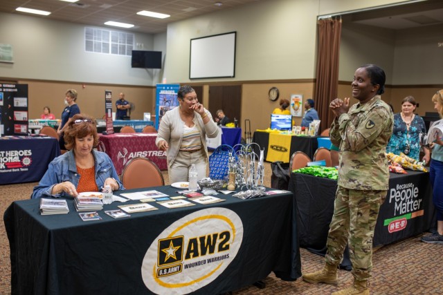 Col. Lakicia Stokes, U.S. Army Garrison-Fort Cavazos commander, speaks with Dr. Chunita Vick, a lead coordinator/recovery care coordinator with the Army Recovery Care Program, and Joy Pasco, also a lead coordinator/recovery care coordinator with ARCP, Sept. 14 at the annual technology fair.  (U.S. Army photo by Samantha Harms, Fort Cavazos Public Affairs)