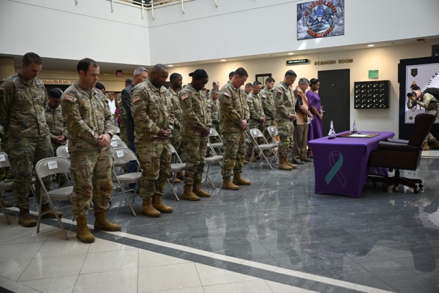 Fort Cavazos military leaders bow their heads during the invocation during the Suicide Prevention proclamation signing Friday at III Armored Corps Headquarters. (U.S. Army photo by Janecze Wright, Fort Cavazos Public Affairs)