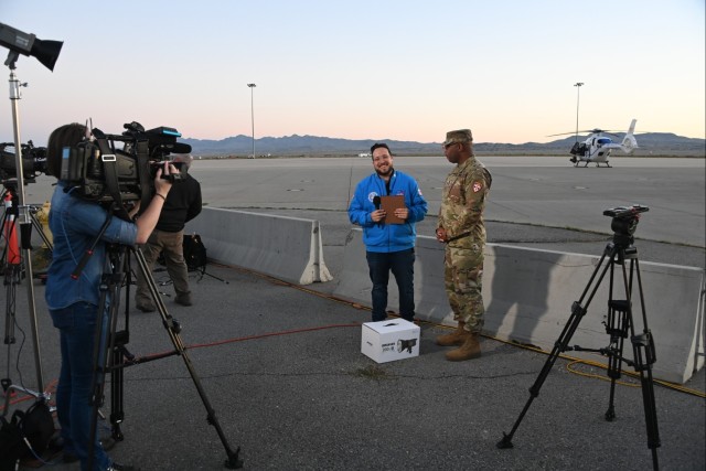 U.S. Army Dugway Proving Ground Command Sgt. Maj. David Henderson (right) is interviewed by Fox 13 reporter Spencer Joseph in the early hours of September 24, 2023 prior to the landing of a sample of the asteroid Bennu at the Utah Test and...