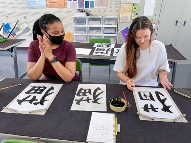 Carr and her English teacher at calligraphy club
