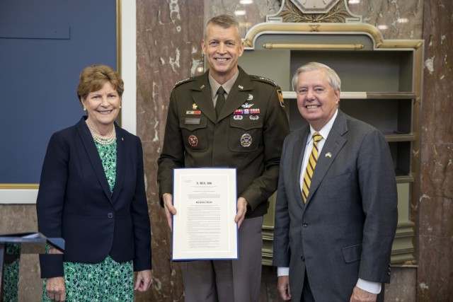 Sen. Jeanne Shaheen and Lindsey Graham, Senate National Guard Caucus co-chairs, present Army Gen. Daniel Hokanson, chief, National Guard Bureau, with a formal copy of Senate Resolution 308 to recognize the historic significance of the 30th...