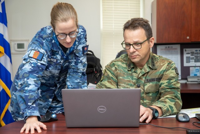 (From left) A U.S. Army Security Assistance Command Security Assistance Liaison Officer from the Australian Air Force assists Lt. Col. Giorgio Vlachos, the Hellenic Army&#39;s SALO at New Cumberland, Penn., Sept. 26, 2023. The SALO program is made up of members from 15 countries and allows direct communication with USASAC’s foreign military sales professionals.