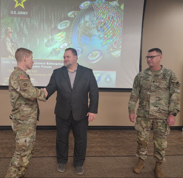 Brig. Gen. Brad Nicholson (left), U.S. Army Security Assistance Command’s Commanding General, and USASAC Command Sgt. Maj. Stephen Burnley (right), recognized Dale Whittaker (center), Program Executive Office (PEO) for Simulation, Training and Instrumentation’s (STRI) International Programs Office (IPO) project lead, for supporting the Kingdom of Saudi Arabia Transition Management Office training cases from the PEO-STRI (IPO) to USASAC. Whittaker received the Commanding General’s coin at the Army Materiel Command Security Assistance Enterprise Senior Leader Forum Sept. 28 at Redstone Arsenal, Ala.