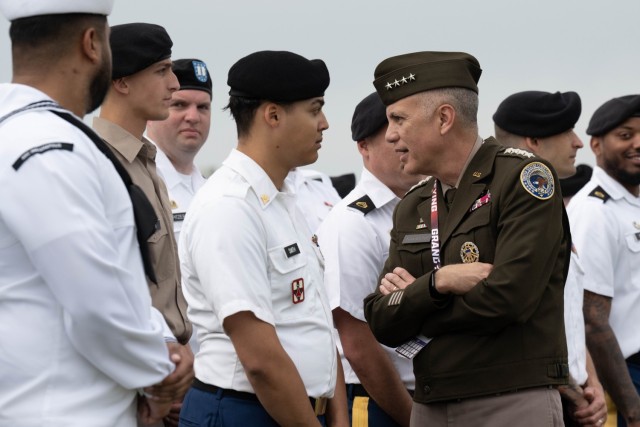 Army Gen. Paul M. Nakasone greets U.S. service members during the opening ceremonies of the Indianapolis 500 at the Indianapolis Motor Speedway in Indianapolis, May 28, 2023. Nakasone, who serves as commander of U.S. Cyber Command, director of the...