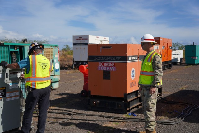 Chief Warrant Officer 2 Maksym Zymin, power mission commander, oversees contracted personnel performing a load bank test on a FEMA generator at the generator staging base in Kahului, Hawaii, Sept. 19. The U.S. Army Corps of Engineers Temporary Emergency Power Planning and Response Team continues to work with FEMA and local, state and federal partners in support of Maui and the Hawai‘i wildfires response. U.S. Army Photo by Katie Newton