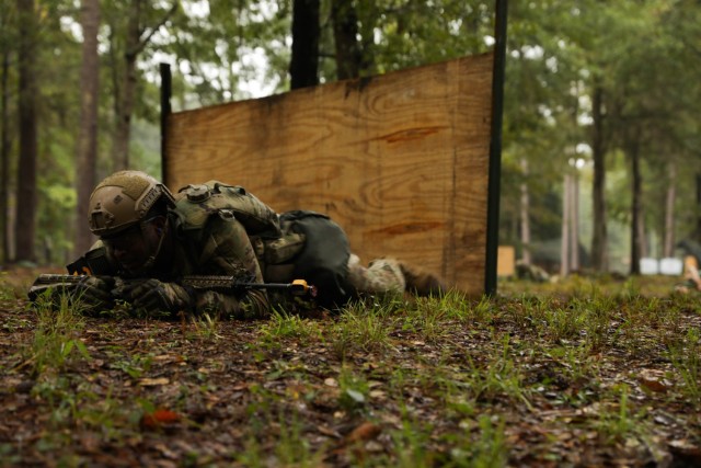 Spc. Rollian Morgan, a native of Sevierville, Tennessee, representing U.S. Army Futures Command, moves under simulated direct fire during the patrol lanes portion of the 2023 Army Best Squad Competition at Fort Stewart, Georgia, Sept. 27, 2023. The competition tests the squad’s proficiency in their warrior tasks and battle drills and identifies the most cohesive, highly trained, disciplined, and fit team that is ready to fight and win – while demonstrating commitment to the Army Values and Warrior Ethos.