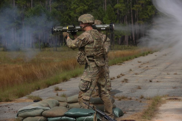 A Soldier representing U.S. Army Reserve fires an anti-tank rocket launcher during the Army Best Squad Competition at Fort Stewart, Georgia, Oct. 3, 2023. Readiness is achieved through building cohesive teams that are highly trained, disciplined and fit. Teams that exemplify these principles are ready to fight and win.