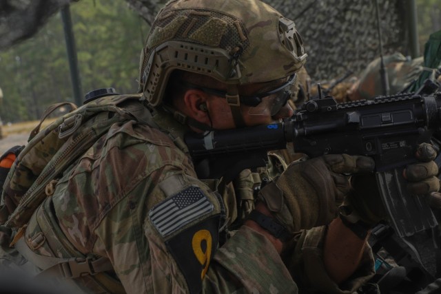 A Soldier representing U.S. Army Special Operations Command provides security during a static live-fire event during the Army Best Squad Competition at Fort Stewart, Georgia, Oct. 3, 2023. Soldiers embody the Army Warrior Ethos during this competition. The Warrior Ethos states, &#34;I will always place the mission first. I will never accept defeat. I will never quit. I will never leave a fallen comrade.” This Ethos is a set of principles by which every Soldier lives and embodies the squad mentality and spirit.